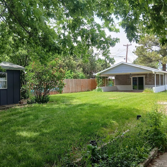 232 Saddle Rd, Trinidad, CO 81082 - view of yard with a ceiling fan, a sunroom, and an attached carport