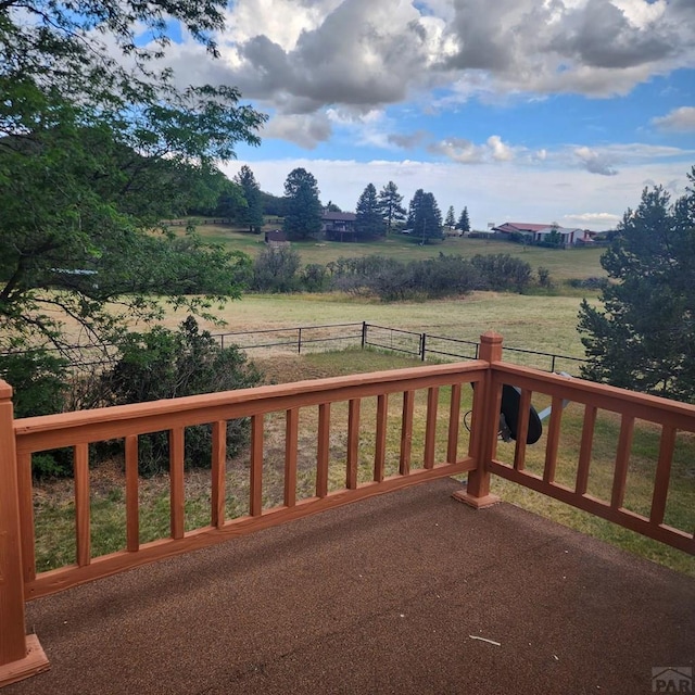 exterior space with a rural view and fence