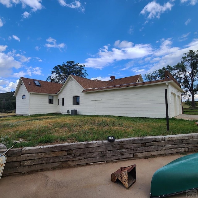 view of property exterior featuring a yard