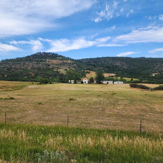 property view of mountains featuring a rural view