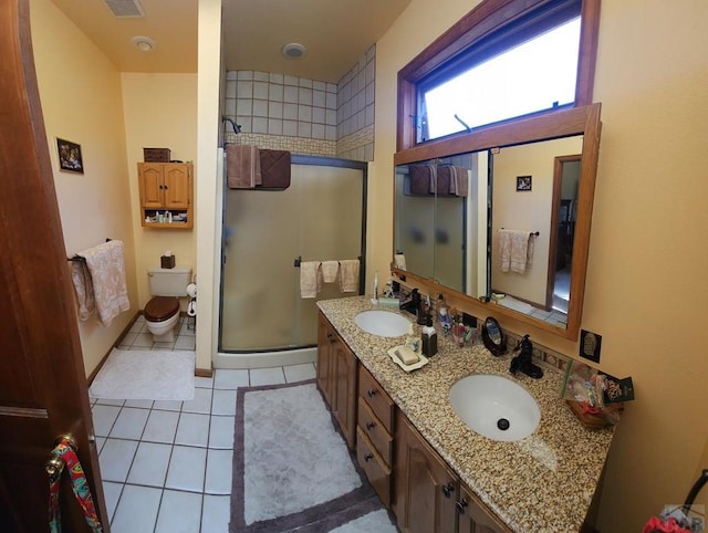 full bath with a shower stall, a sink, and tile patterned floors