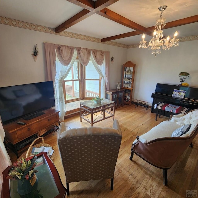 living room with baseboards, coffered ceiling, light wood-type flooring, a chandelier, and beam ceiling