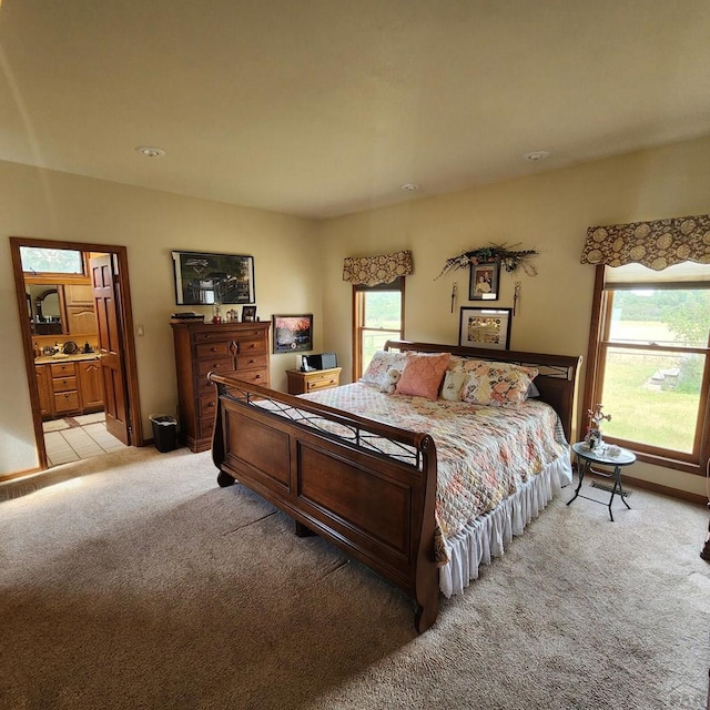 bedroom featuring light colored carpet