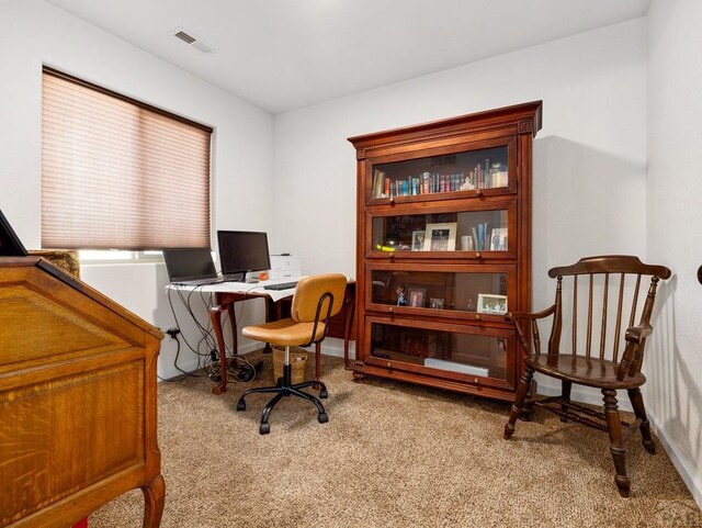 office featuring visible vents and light colored carpet