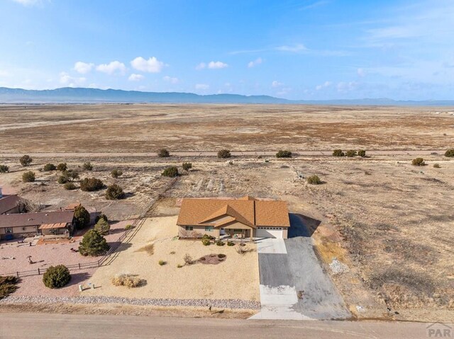 bird's eye view with view of desert and a mountain view