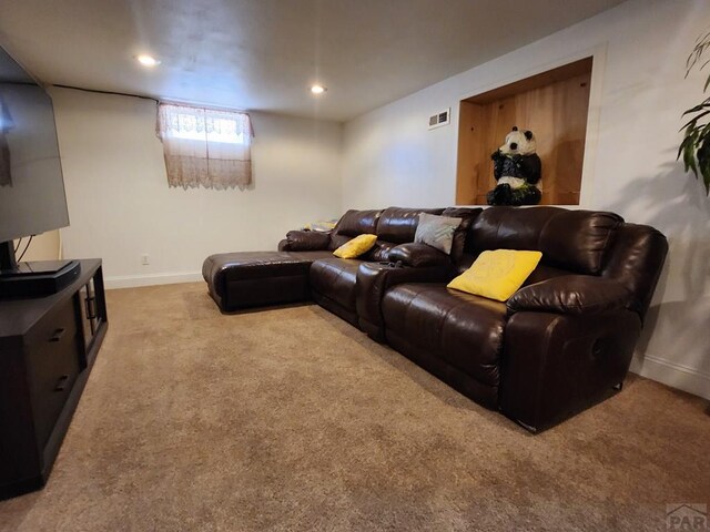 living area with light colored carpet, visible vents, baseboards, and recessed lighting