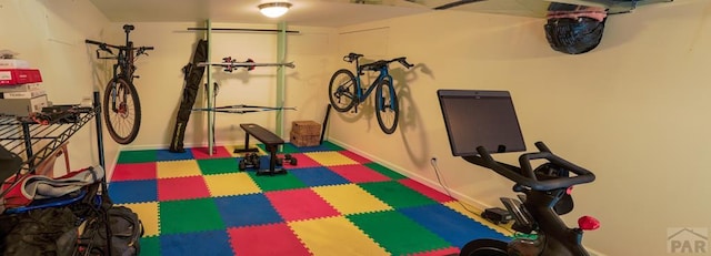 709 Cimarron Ave, La Junta, CO 81050 - workout room featuring baseboards