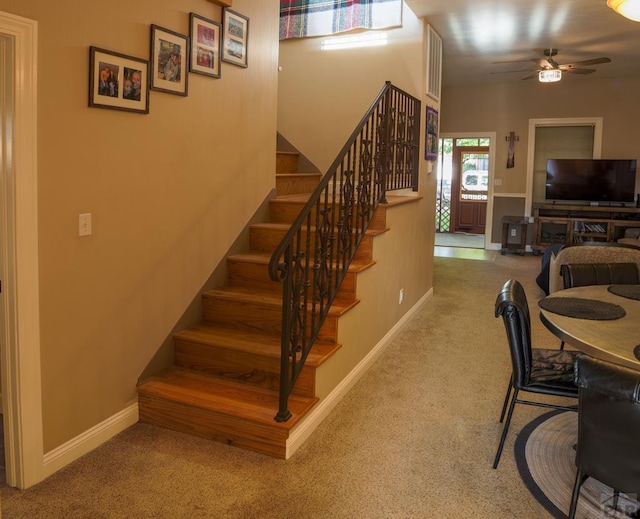 709 Cimarron Ave, La Junta, CO 81050 - staircase featuring carpet floors, a ceiling fan, and baseboards