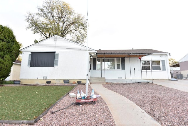 single story home with a front yard, crawl space, and central AC unit