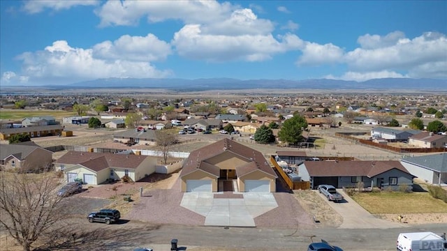 aerial view featuring a residential view and a mountain view