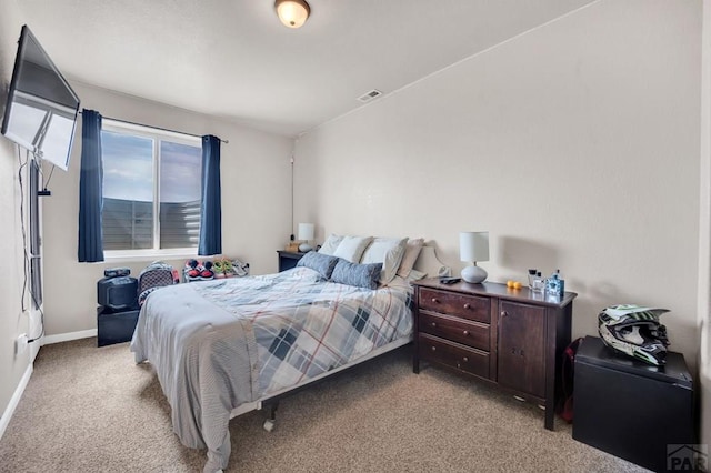 bedroom with baseboards, visible vents, and carpet floors