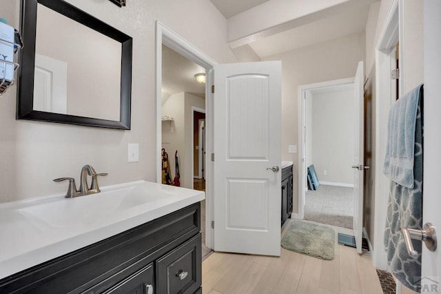 bathroom with vanity and wood finished floors