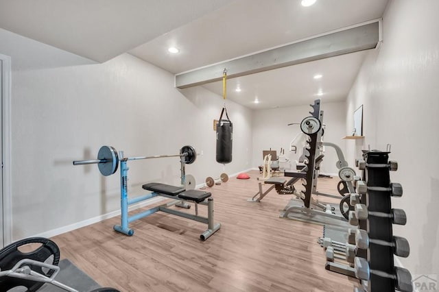workout room with recessed lighting, wood finished floors, and baseboards