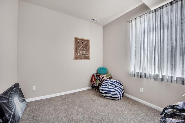 unfurnished room featuring baseboards, carpet flooring, and visible vents