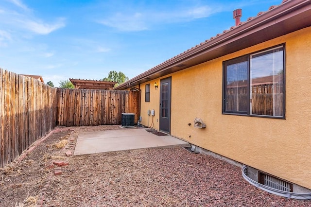 view of patio featuring cooling unit and a fenced backyard