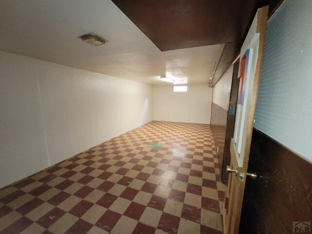 bonus room featuring dark floors