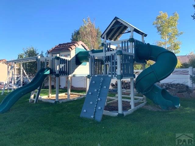 view of jungle gym featuring a yard