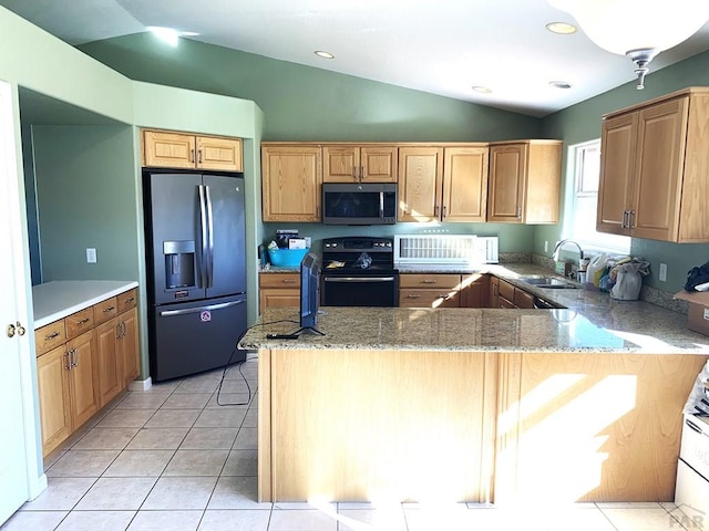 kitchen with light tile patterned floors, black electric range oven, a sink, stainless steel fridge, and a peninsula