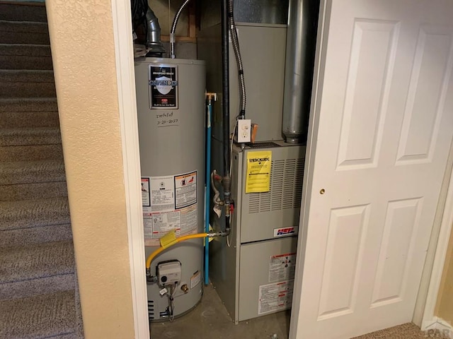 utility room with water heater