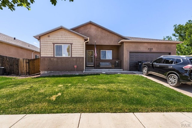 3327 Lions Pride Ln, Pueblo, CO 81005 - ranch-style home featuring an attached garage