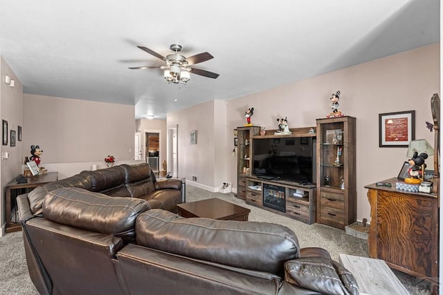3327 Lions Pride Ln, Pueblo, CO 81005 - carpeted living area with a ceiling fan and baseboards