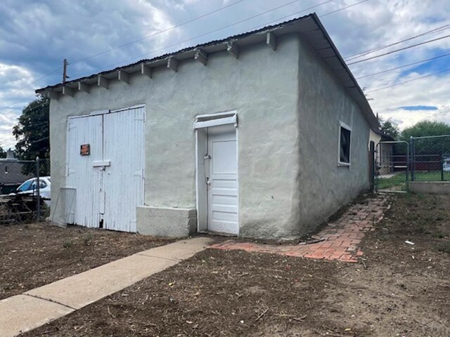 view of outdoor structure with fence