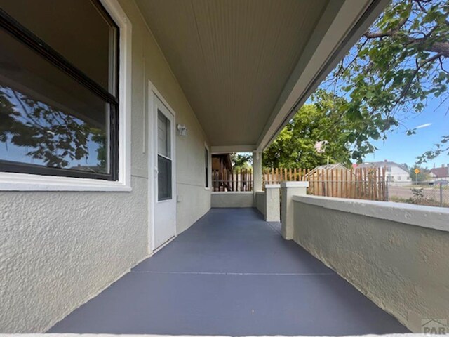 view of patio featuring a balcony