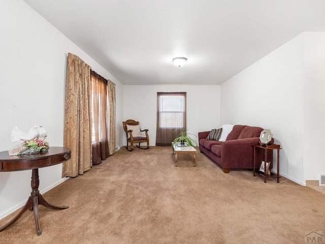 1040 28th Ln, Pueblo, CO 81006 - sitting room with light carpet and baseboards
