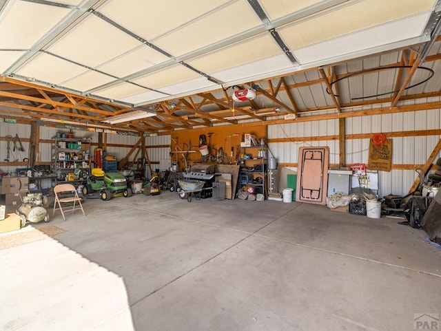 1040 28th Ln, Pueblo, CO 81006 - garage with a garage door opener and metal wall