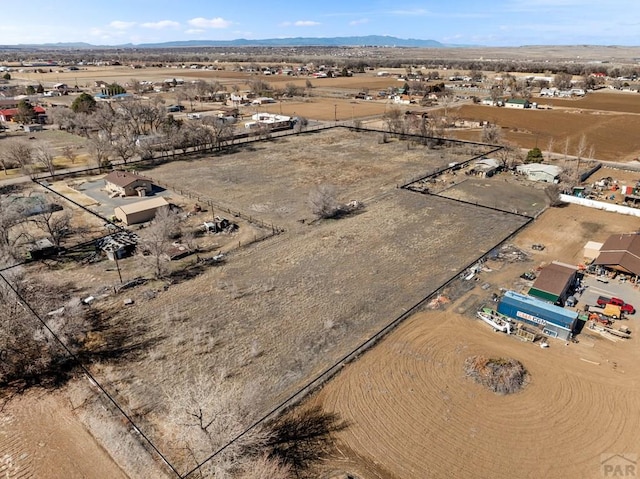 1040 28th Ln, Pueblo, CO 81006 - drone / aerial view with a mountain view and view of desert