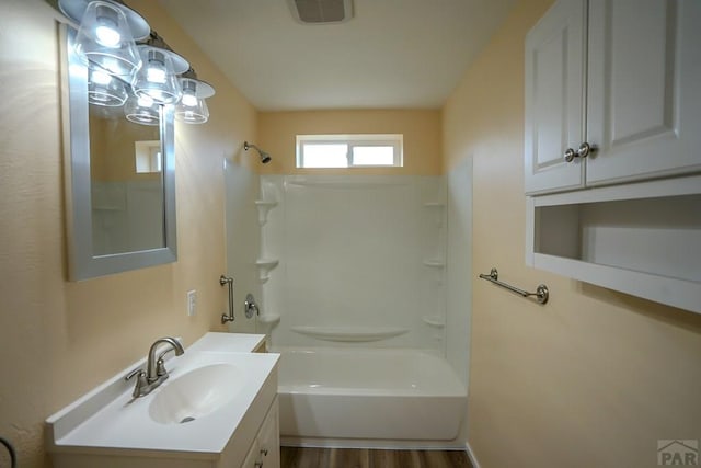 202 Pinon St, Walsenburg, CO 81089 - bathroom with vanity,  shower combination, and wood finished floors