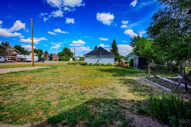 202 Pinon St, Walsenburg, CO 81089 - view of grassy yard with a storage shed