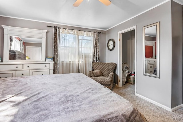 bedroom with baseboards, crown molding, a ceiling fan, and light colored carpet