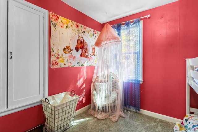 interior space with carpet floors and baseboards