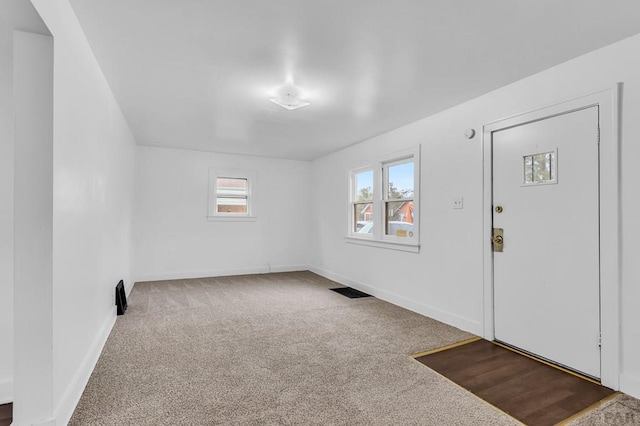 interior space featuring baseboards