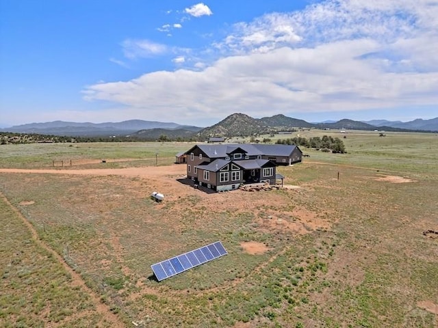 drone / aerial view featuring a rural view and a mountain view