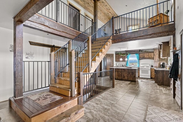 5010 Oak Grove Cir, Westcliffe, CO 81252 - stairs with a towering ceiling