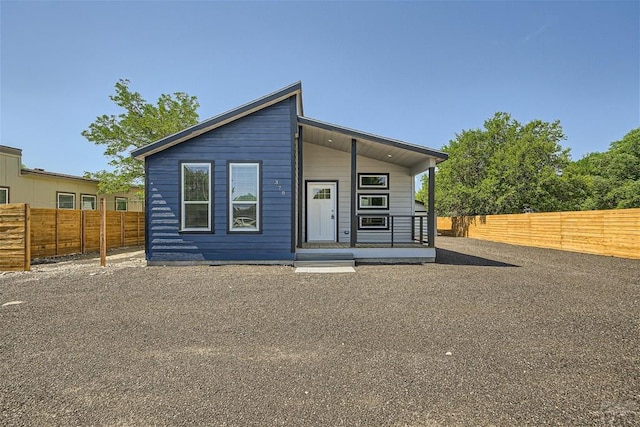 view of front of house with fence private yard and covered porch