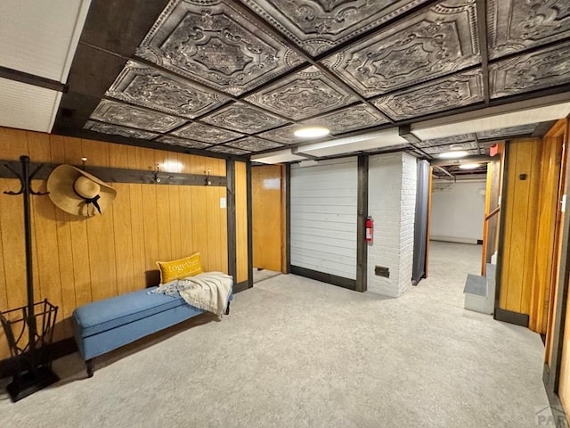 303 S Animas St, Trinidad, CO 81082 - finished basement featuring light carpet and wood walls
