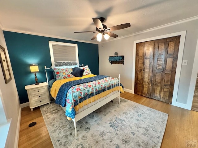 303 S Animas St, Trinidad, CO 81082 - bedroom featuring crown molding, wood finished floors, and a ceiling fan