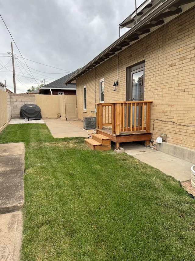 303 S Animas St, Trinidad, CO 81082 - fenced backyard with a wooden deck and a patio area