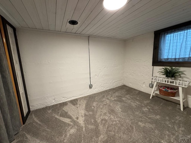 303 S Animas St, Trinidad, CO 81082 - carpeted empty room with wooden ceiling and a textured wall