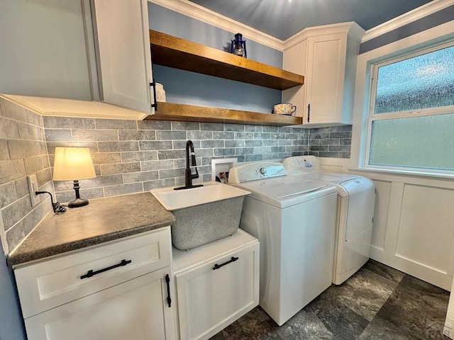 303 S Animas St, Trinidad, CO 81082 - laundry area featuring washer and dryer and cabinet space