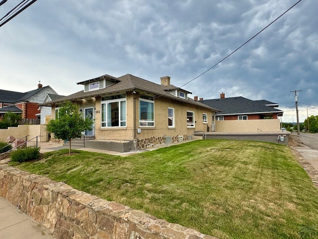 303 S Animas St, Trinidad, CO 81082 - rear view of house with brick siding and a chimney