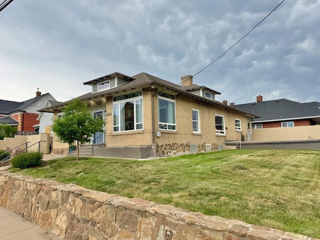 303 S Animas St, Trinidad, CO 81082 - back of property featuring brick siding and a chimney