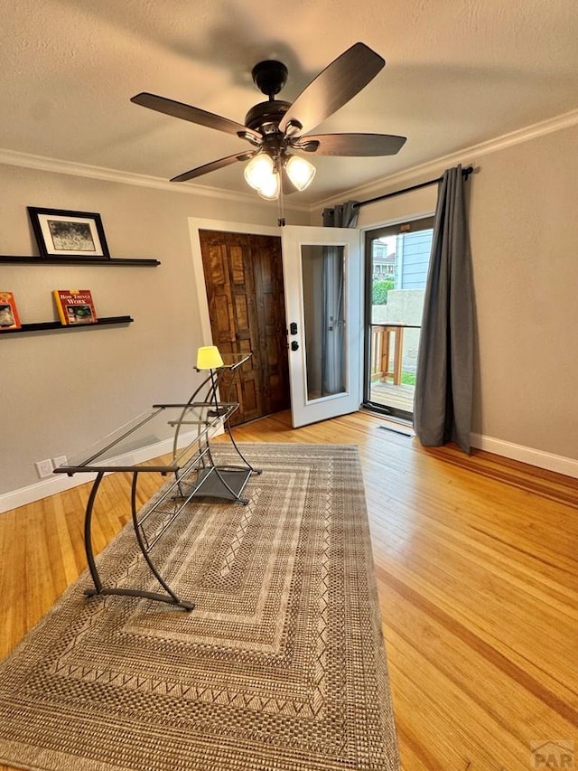303 S Animas St, Trinidad, CO 81082 - unfurnished room featuring ornamental molding, light wood finished floors, ceiling fan, and a textured ceiling