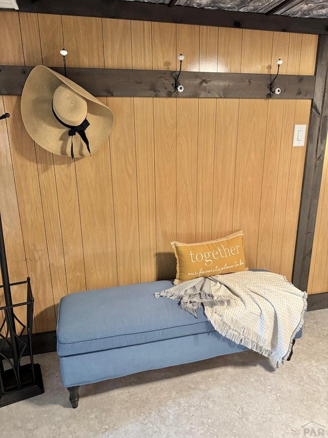 303 S Animas St, Trinidad, CO 81082 - bedroom featuring unfinished concrete flooring and wooden walls