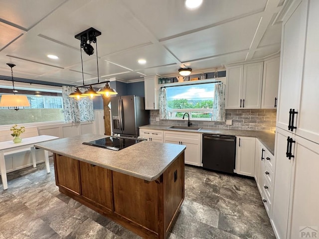 303 S Animas St, Trinidad, CO 81082 - kitchen featuring dishwashing machine, stainless steel refrigerator with ice dispenser, black electric cooktop, a kitchen island, and white cabinets