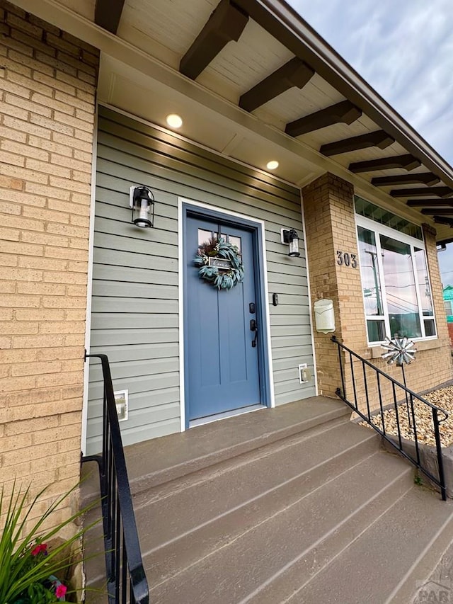 303 S Animas St, Trinidad, CO 81082 - property entrance featuring brick siding