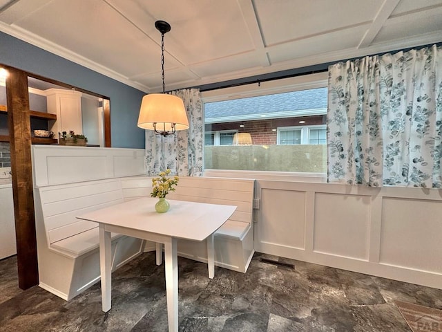 303 S Animas St, Trinidad, CO 81082 - dining area with a wainscoted wall, crown molding, and a decorative wall
